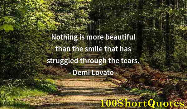 Quote by Albert Einstein: Nothing is more beautiful than the smile that has struggled through the tears.